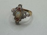 a close up of a ring on a table with a white background