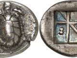 a close up of a coin with a picture of a woman on it