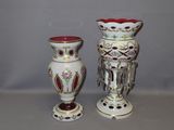 two vases sitting next to each other on a table
