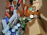 a cardboard box filled with various types of beverages
