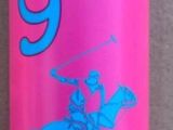 a pink bottle with a blue lid sitting on a tiled floor