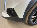 a close up of the front end of a white car