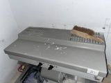 an image of a dirty stove with a brush on top