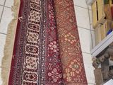 two rugs that are laying on the floor