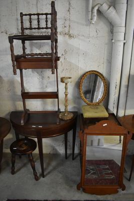 several pieces of furniture are sitting in a room with a mirror on the wall