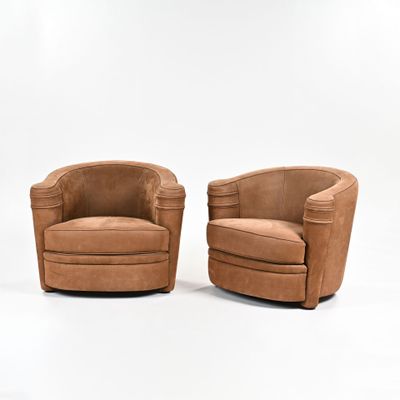 paire de fauteuils pivotants de style « mid-century » en cuir beige