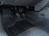 a close up of a car ' s floor with a steering wheel