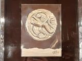 a picture of a picture of an octopus in a glass frame