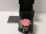 a clock on the back of a box on a table