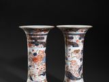 pair of chinese vases on a black background
