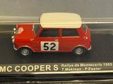 a miniature red car with a white roof and number 52 on it