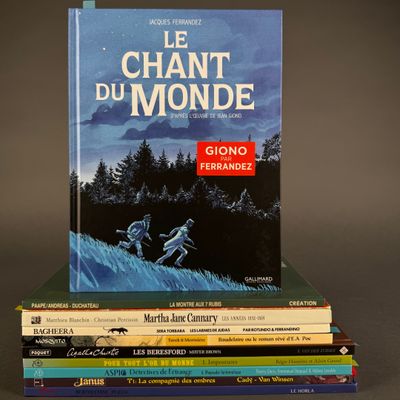 many books stacked on top of each other on a table