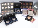 several different types of coins are in a box on a table