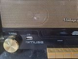 a radio sitting on top of a table next to a cardboard box