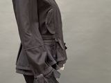an image of a mannequin wearing a black jacket and pants
