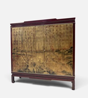 an image of a cabinet with a painting on the door