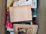 a box full of books sitting on top of a table