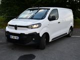a white van that is parked in a parking lot