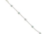 a white gold bracelet with blue topaz and diamonds
