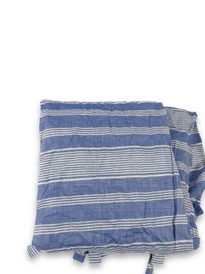 the blue and white striped towel is folded up on a white background