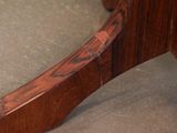 a close up view of a wooden table with a glass top