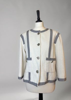 an image of a white and gray jacket on a mannequin
