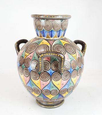 a vase with a colorful design on it on a white background