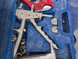 a blue case with tools in it on a table
