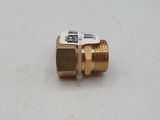 a close up of a brass fitting on a white surface