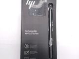 a box with a pen inside of it on a white surface