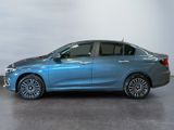 the blue car is parked in a room with a white wall