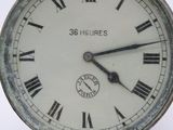 a close up of a clock with roman numerals on it