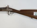 a winchester rifle with a wooden barrel and a wooden case
