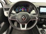 the interior of a car with a steering wheel and dashboard controls