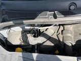 a picture of a car engine with its hood open