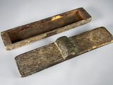 pair of antique wooden boxes with carvings on them on a white surface