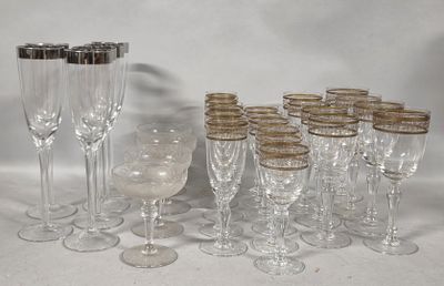 a lot of wine glasses that are sitting on a table