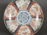 an image of a decorative plate on a stand on a table