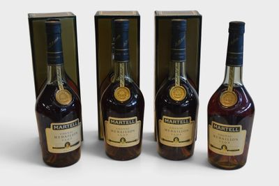 three bottles of whiskey sitting next to each other on a white surface