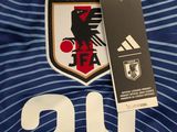a close up of a soccer jersey with a tag on it