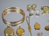 a lot of gold and silver jewelry on a table