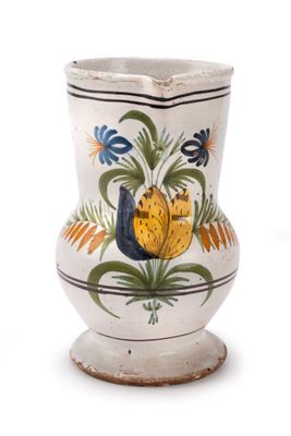 a white vase with a floral design on it