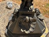 a statue of a bird sitting on top of a base