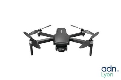 the dji drone is ready to take off from the ground