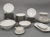 a lot of plates and bowls on the table