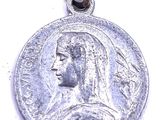 a close up of a silver coin on a white surface