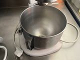 a mixer on the counter in the kitchen next to a blender