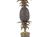 a close up of a table lamp with a pineapple on it