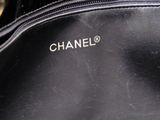 a close up of a chanel bag with the name on it