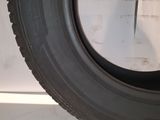 a close up of a tire on a white surface